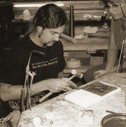 Vintage photograph of a younger Todd working in his studio